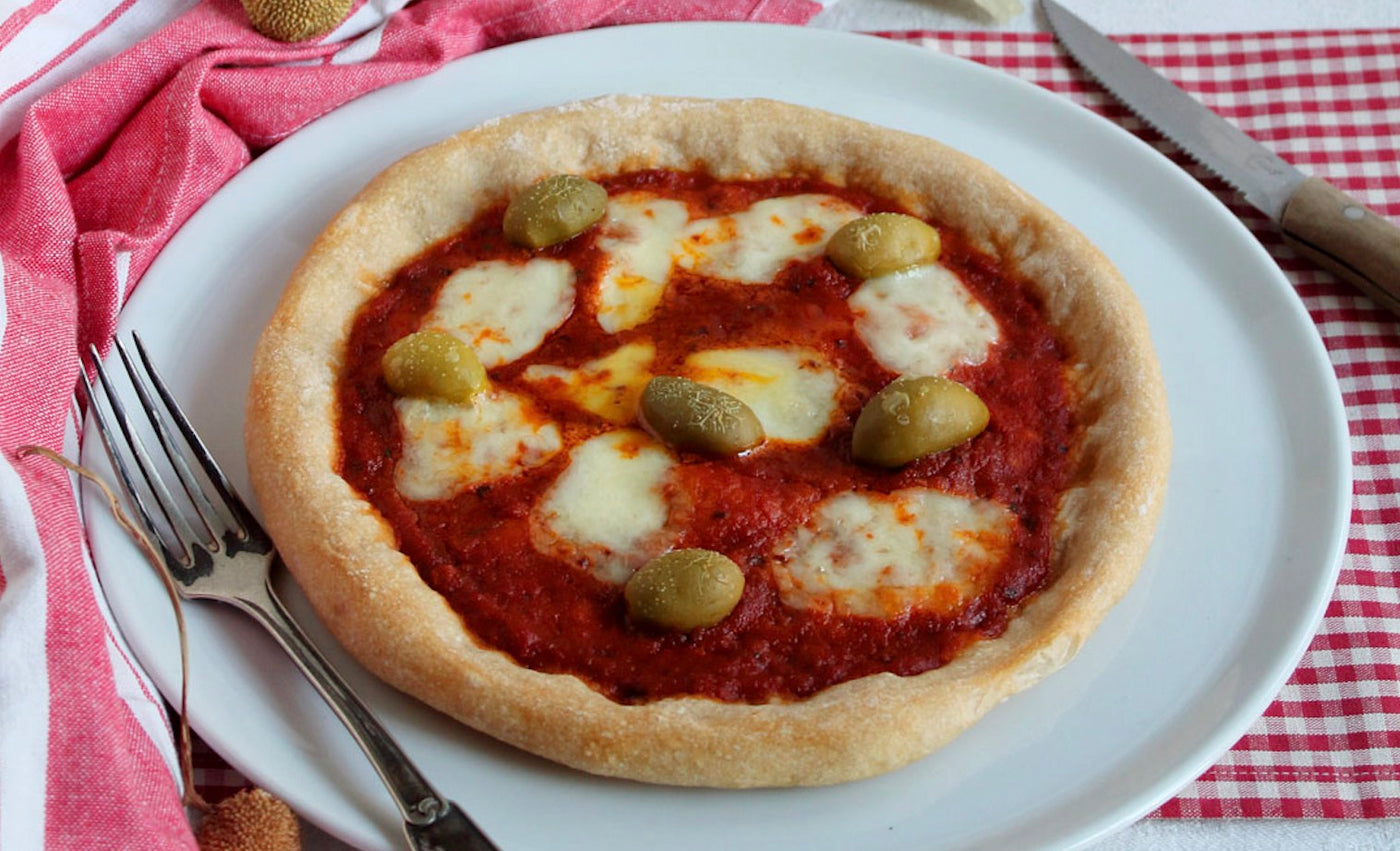 Home Made Pizza with Tomato and Basil Sauce and “Bella di Cerignola” Olives