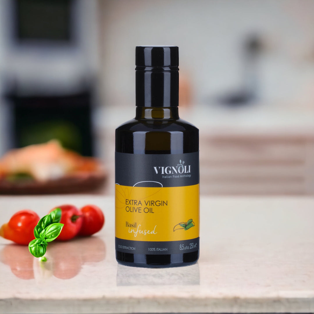 Basil Infused Extra Virgin Olive Oil front of 8.5oz bottle on table with tomatoes and basil