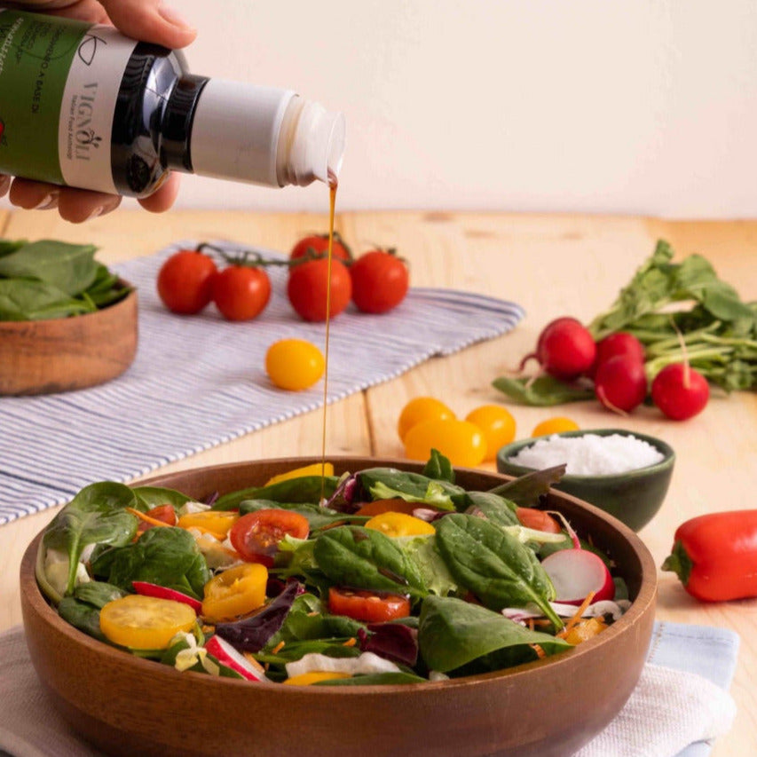 Apple Infused Balsamic Vinegar pouring over salad