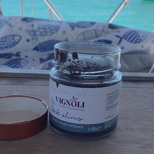 Black Olives Cream Tapenade front of 7oz jar with crackers being dipped