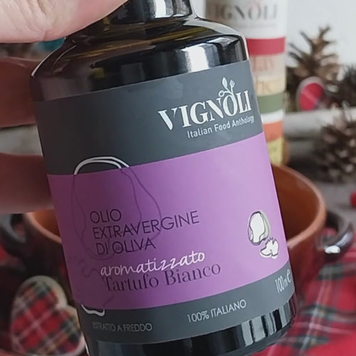 Vignoli White Truffle Infused Extra Virgin Olive Oil front of 8.5oz bottle being poured over mashed potatoes